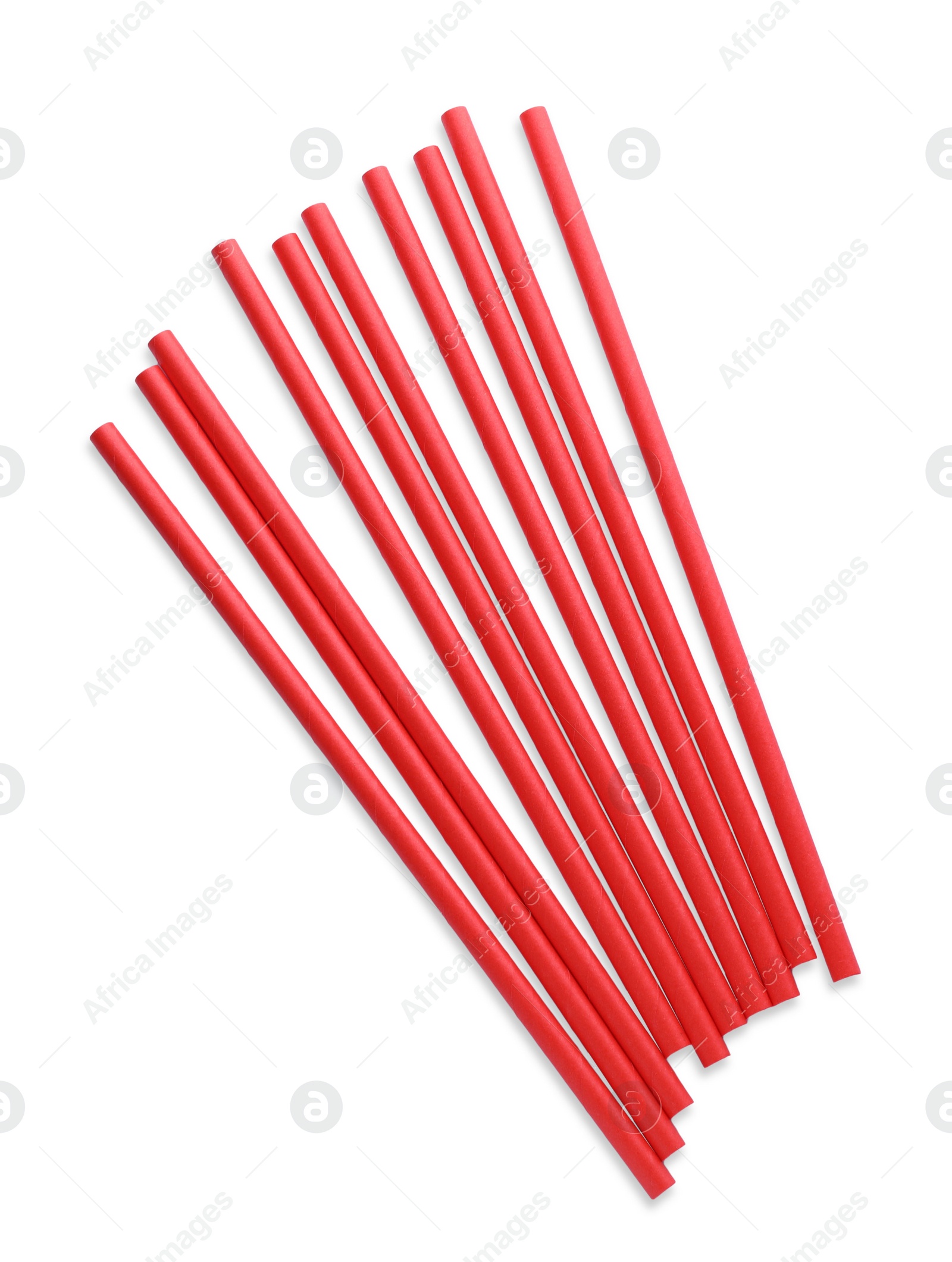 Photo of Red paper cocktail straws on white background, top view