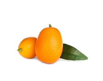 Fresh ripe kumquats with leaves on white background. Exotic fruit