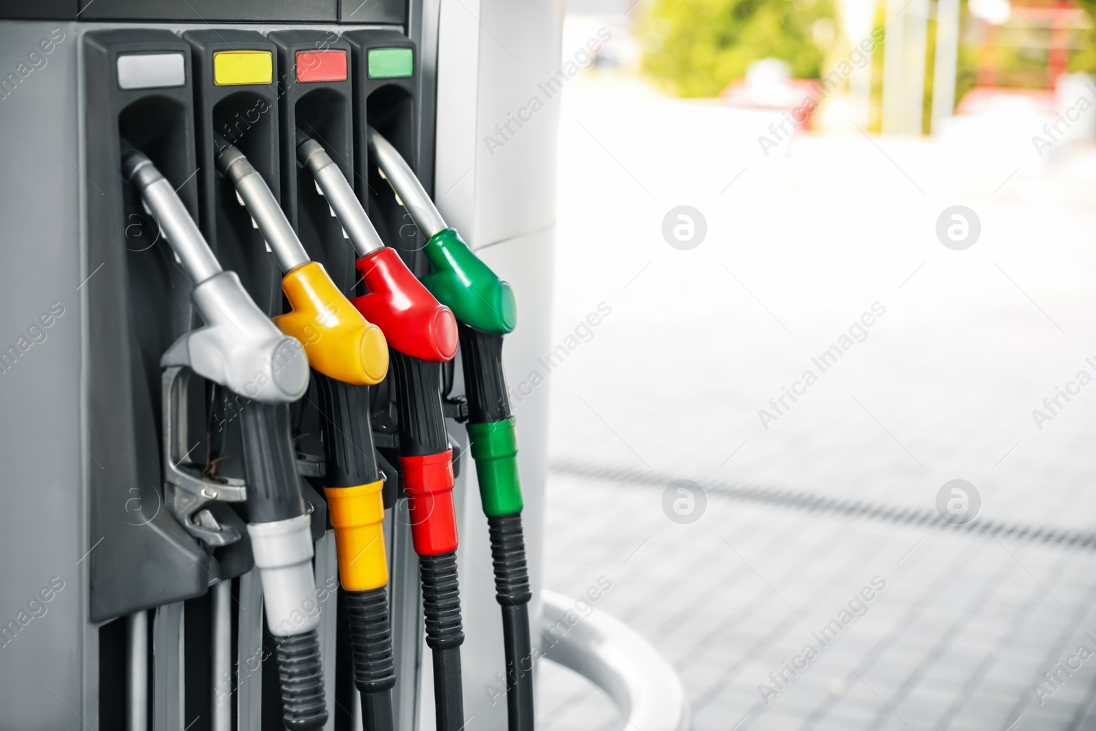 Photo of Fuel pump nozzles at modern gas station