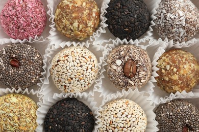 Photo of Assortment of different delicious vegan candy balls, top view