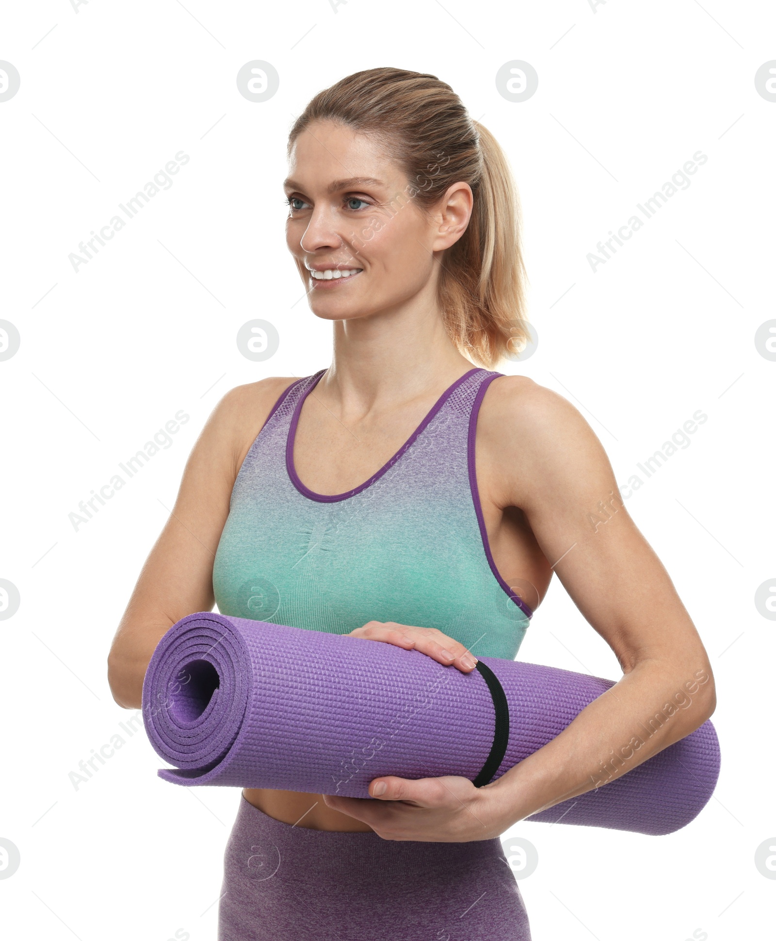 Photo of Portrait of sportswoman with fitness mat on white background