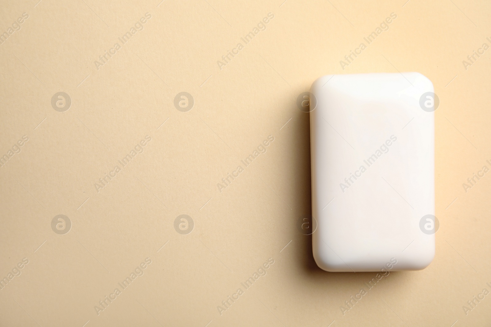 Photo of Soap bar on color background, top view. Space for text