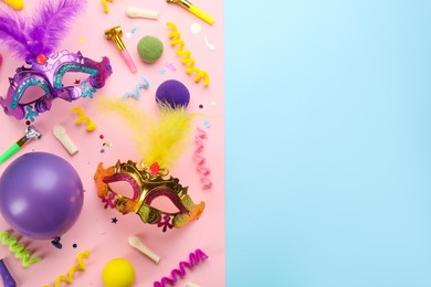 Photo of Flat lay composition with carnival items on color background. Space for text