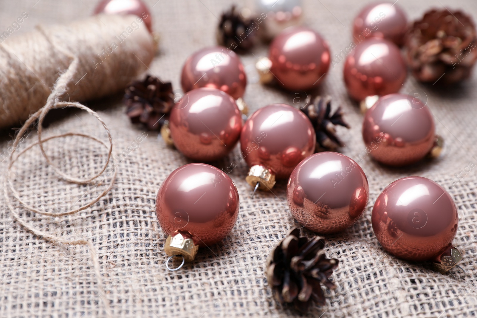 Photo of Composition with beautiful Christmas baubles on sacking