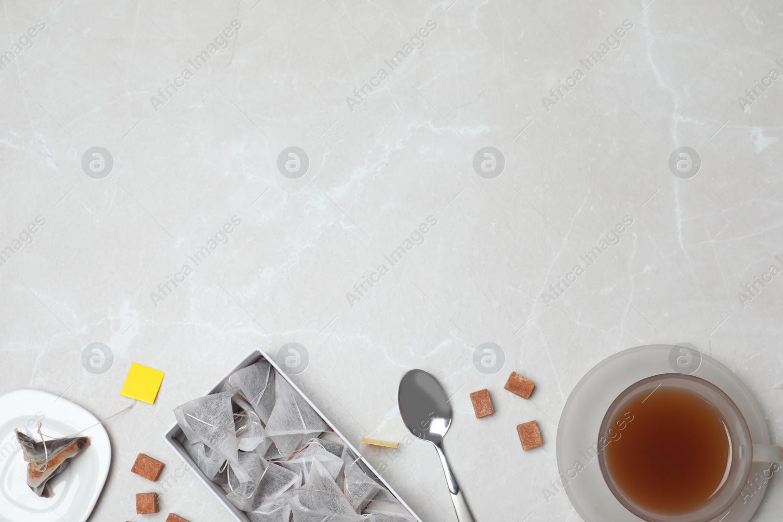 Photo of Flat lay composition with fresh tea and space for text on table