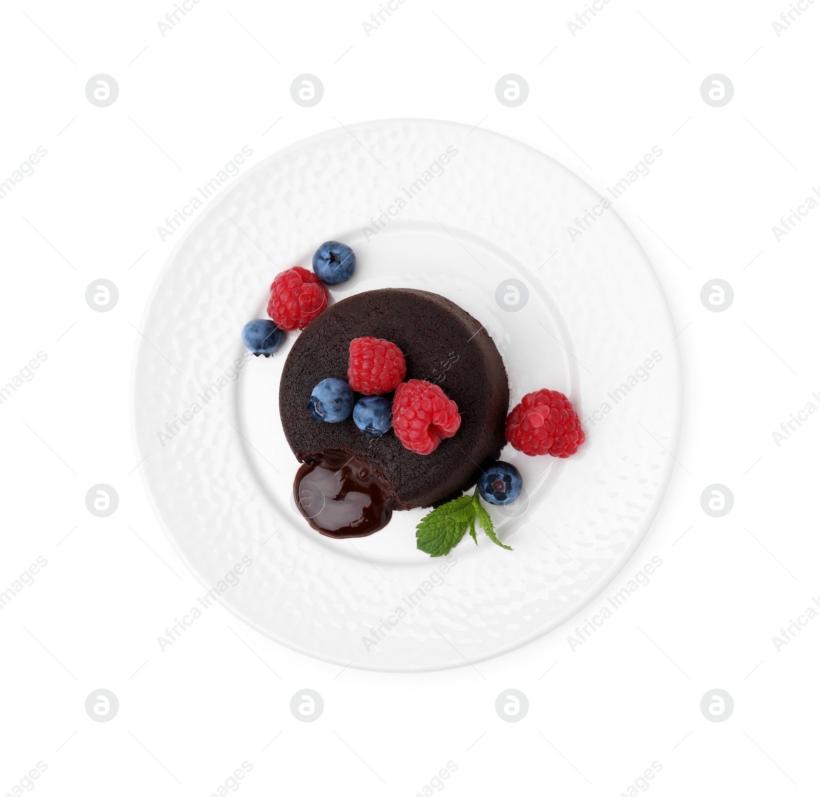 Photo of Plate with delicious chocolate fondant, berries and mint isolated on white, top view