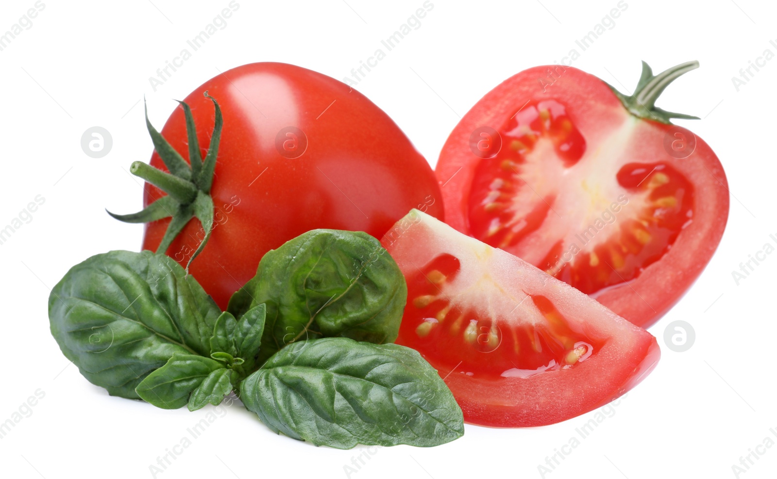 Photo of Fresh green basil leaves with cut and whole tomatoes on white background