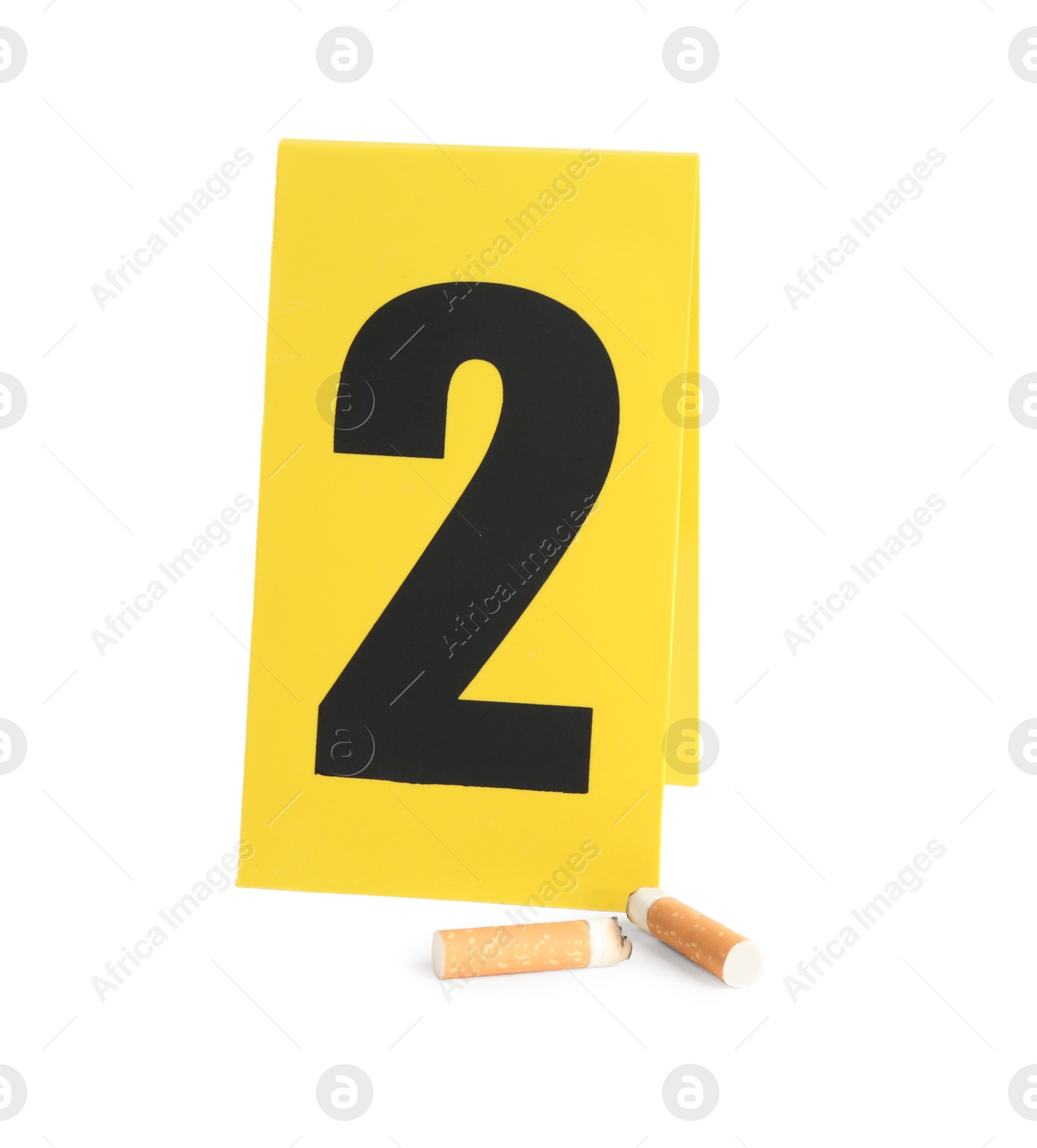 Photo of Cigarette stubs and crime scene marker with number two isolated on white