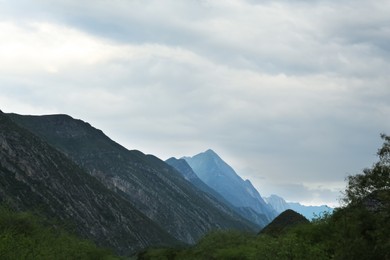 Photo of Picturesque landscape with high mountains under gloomy sky outdoors