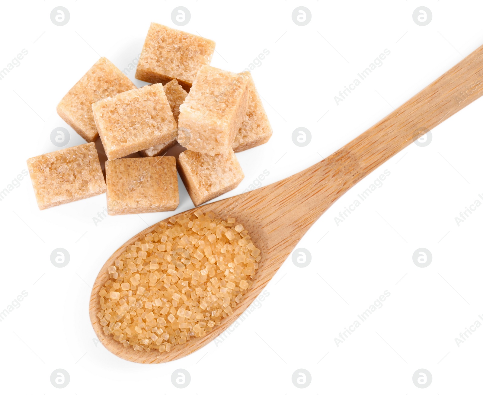 Photo of Different types of brown sugar and spoon isolated on white, top view