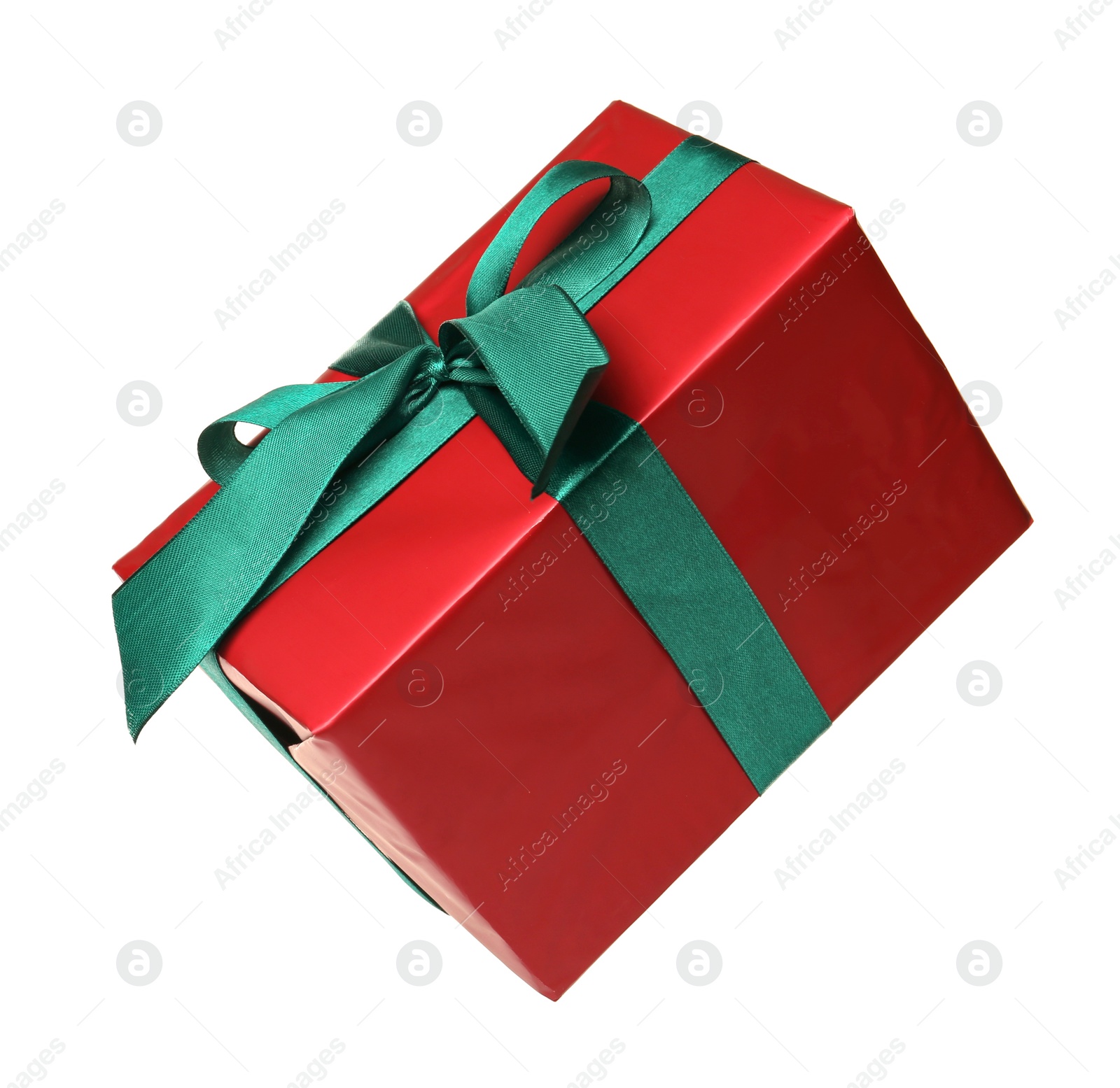 Photo of Red gift box with green bow isolated on white