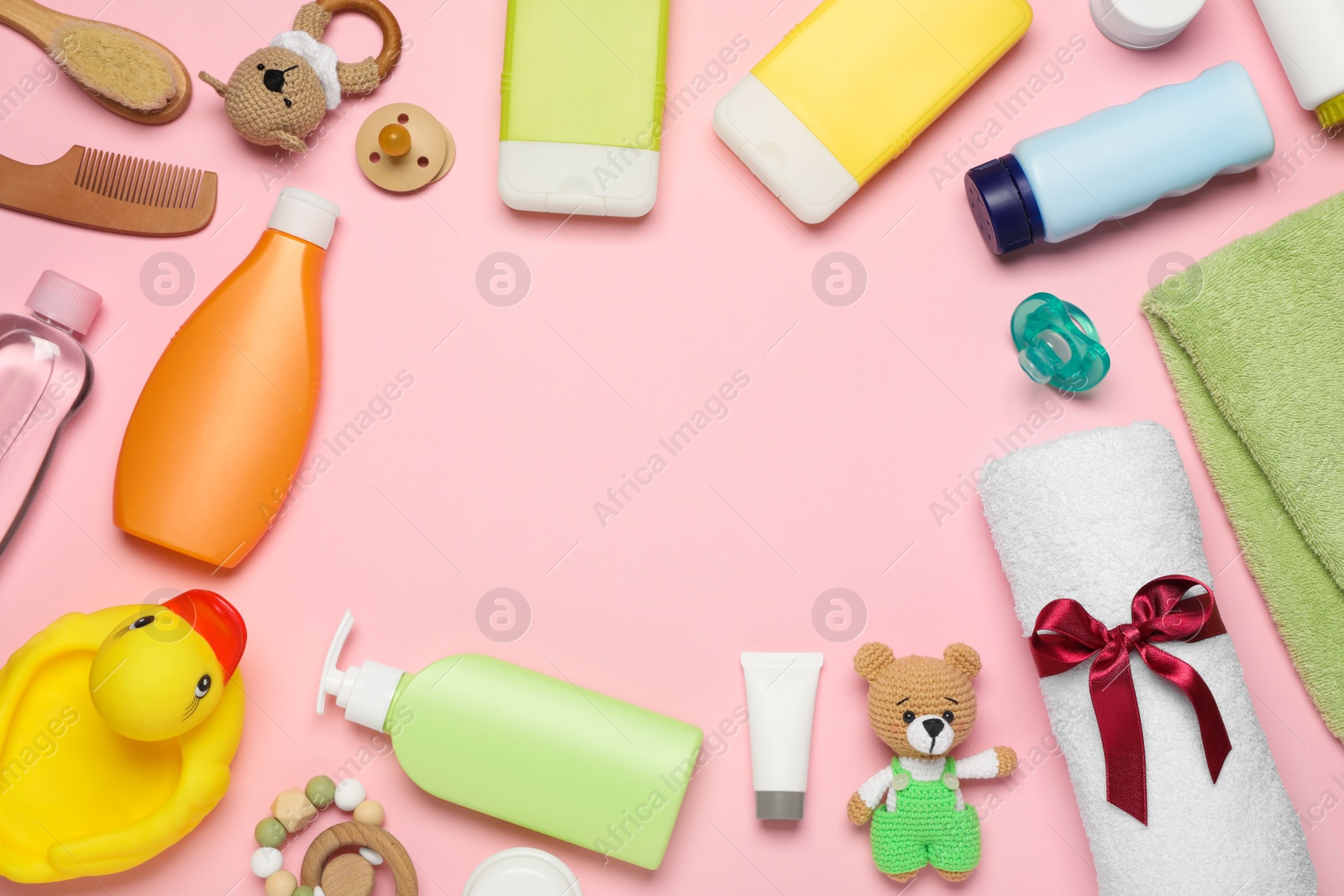 Photo of Flat lay composition with baby cosmetic products on pink background, space for text