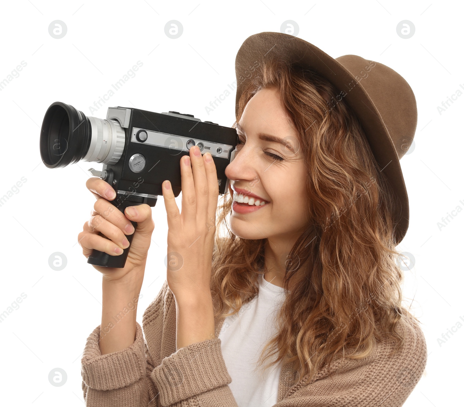 Photo of Beautiful young woman using vintage video camera on white background