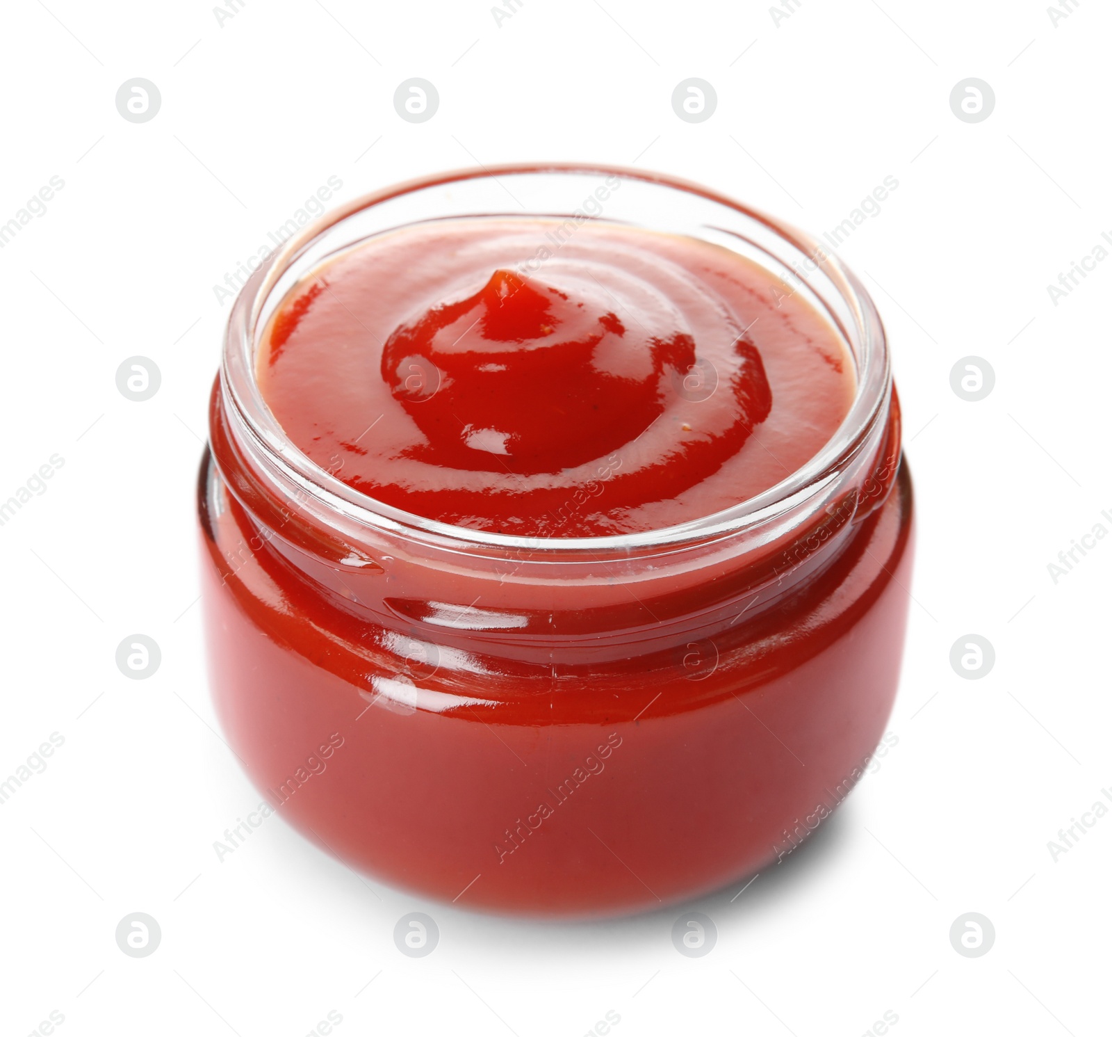 Photo of Tasty homemade tomato sauce in glass jar on white background