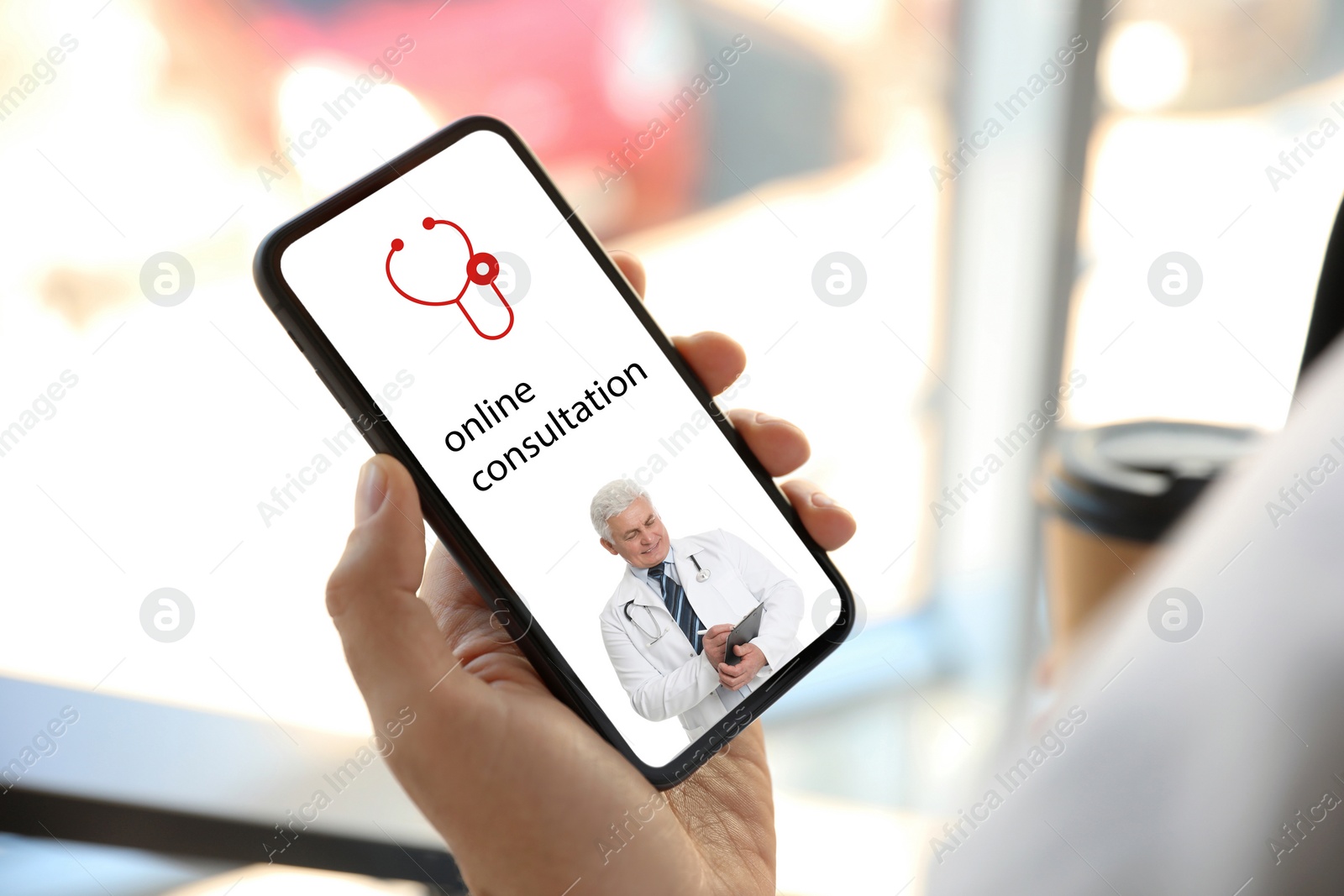 Image of Man using smartphone for online consultation with doctor via video chat, closeup