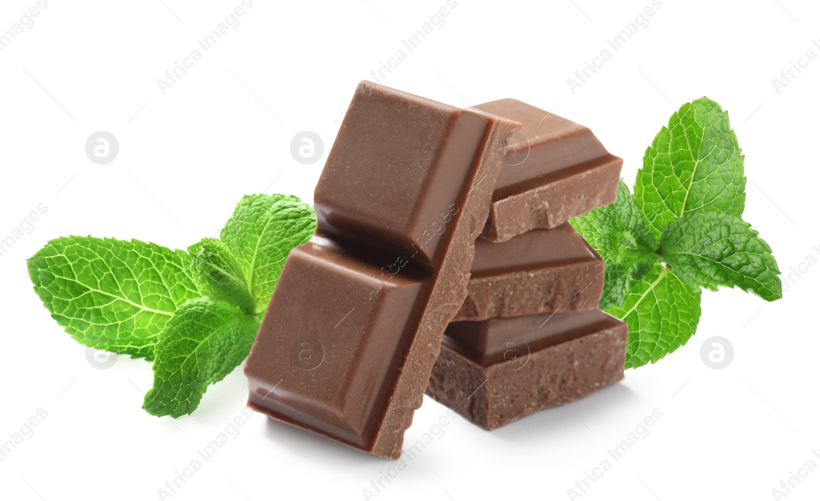 Image of Tasty milk chocolate pieces and mint on white background