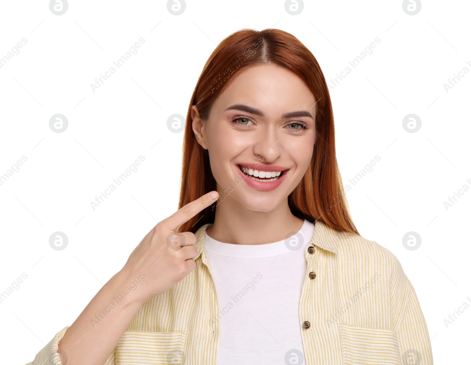 Photo of Beautiful woman showing her clean teeth and smiling on white background