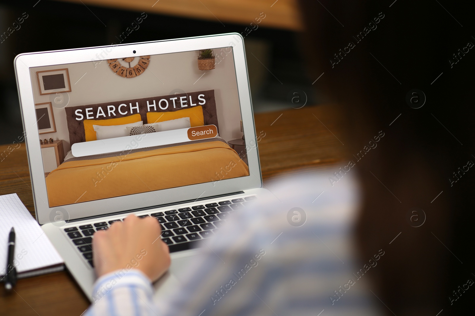 Image of Woman searching hotel using laptop at table, closeup. Booking online service