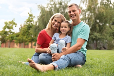 Photo of Happy family spending time together in park on sunny summer day