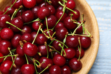 Photo of Sweet ripe juicy cherries in bowl, closeup