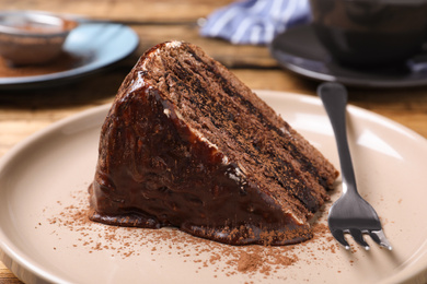 Photo of Delicious chocolate cake on table, closeup view