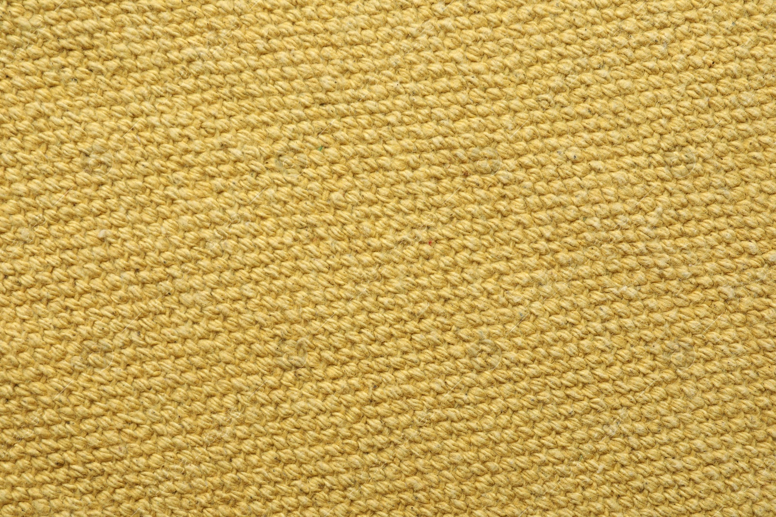 Photo of Texture of golden color fabric as background, top view