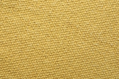 Texture of golden color fabric as background, top view