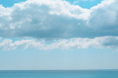 Photo of PIcturesque view of calm sea under cloudy sky
