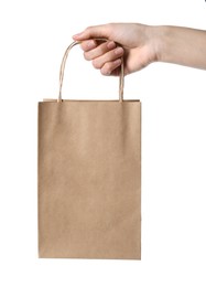 Photo of Woman holding kraft paper bag on white background, closeup. Mockup for design
