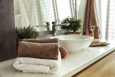 Modern bathroom interior with stylish mirror and vessel sink