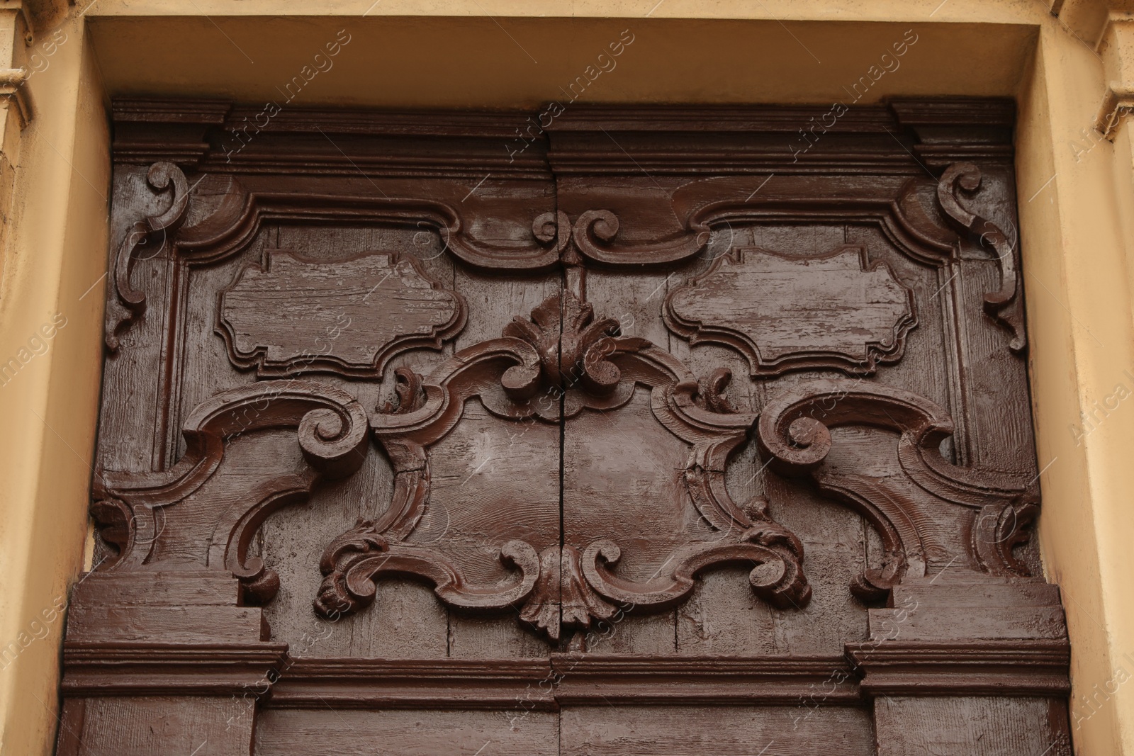 Photo of Ornate wooden door of old building, closeup