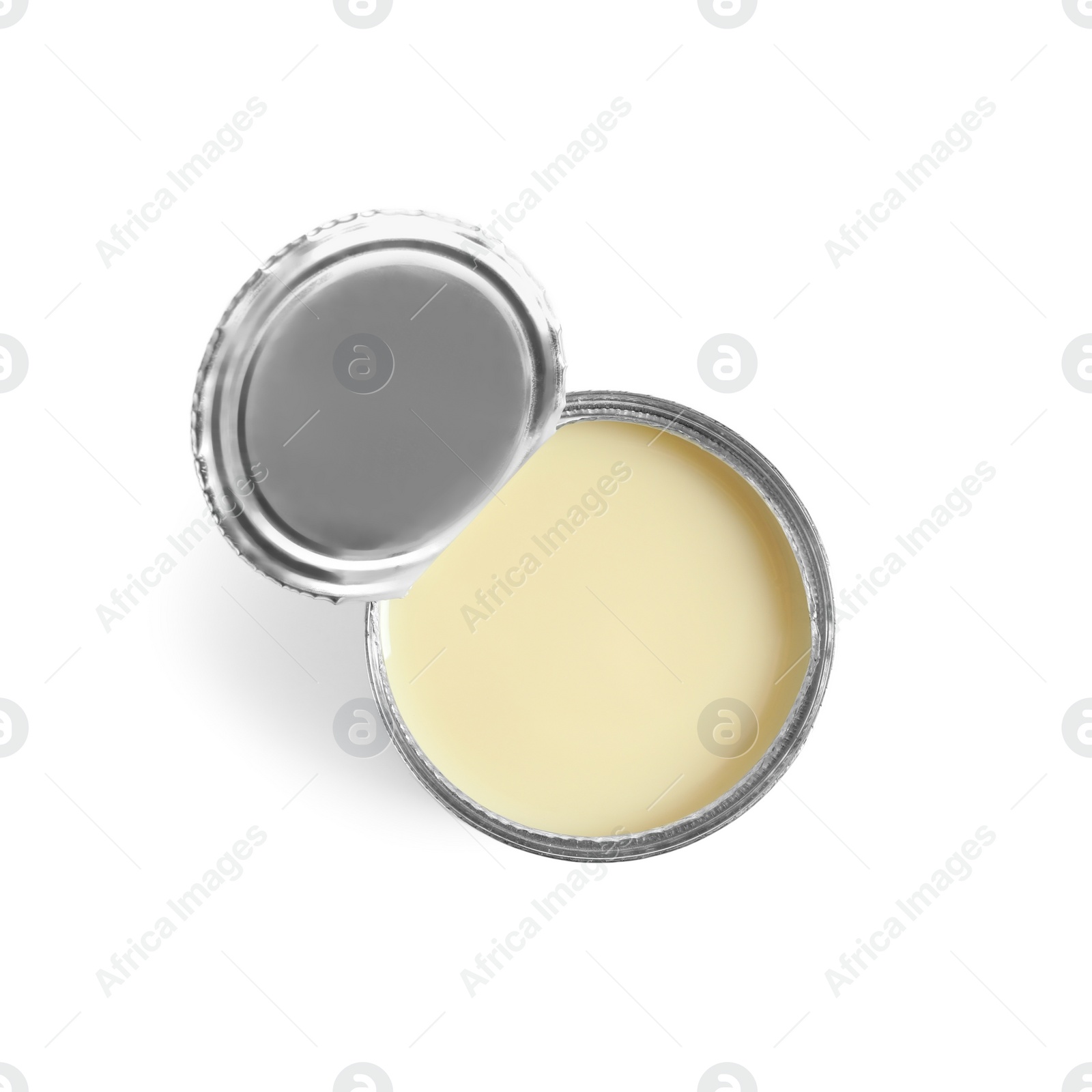 Photo of Tin can with condensed milk on white background, top view. Dairy product