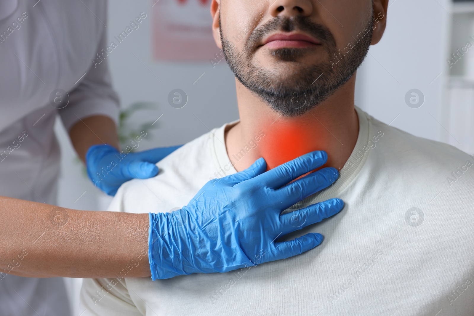 Image of Endocrinologist examining thyroid gland of patient at hospital, closeup