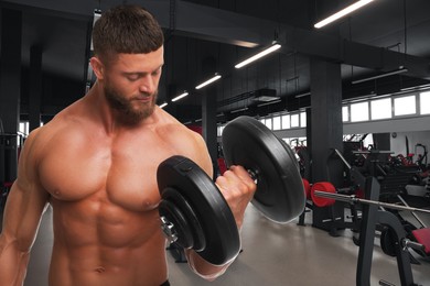 Handsome bodybuilder exercising with dumbbells in gym, space for text