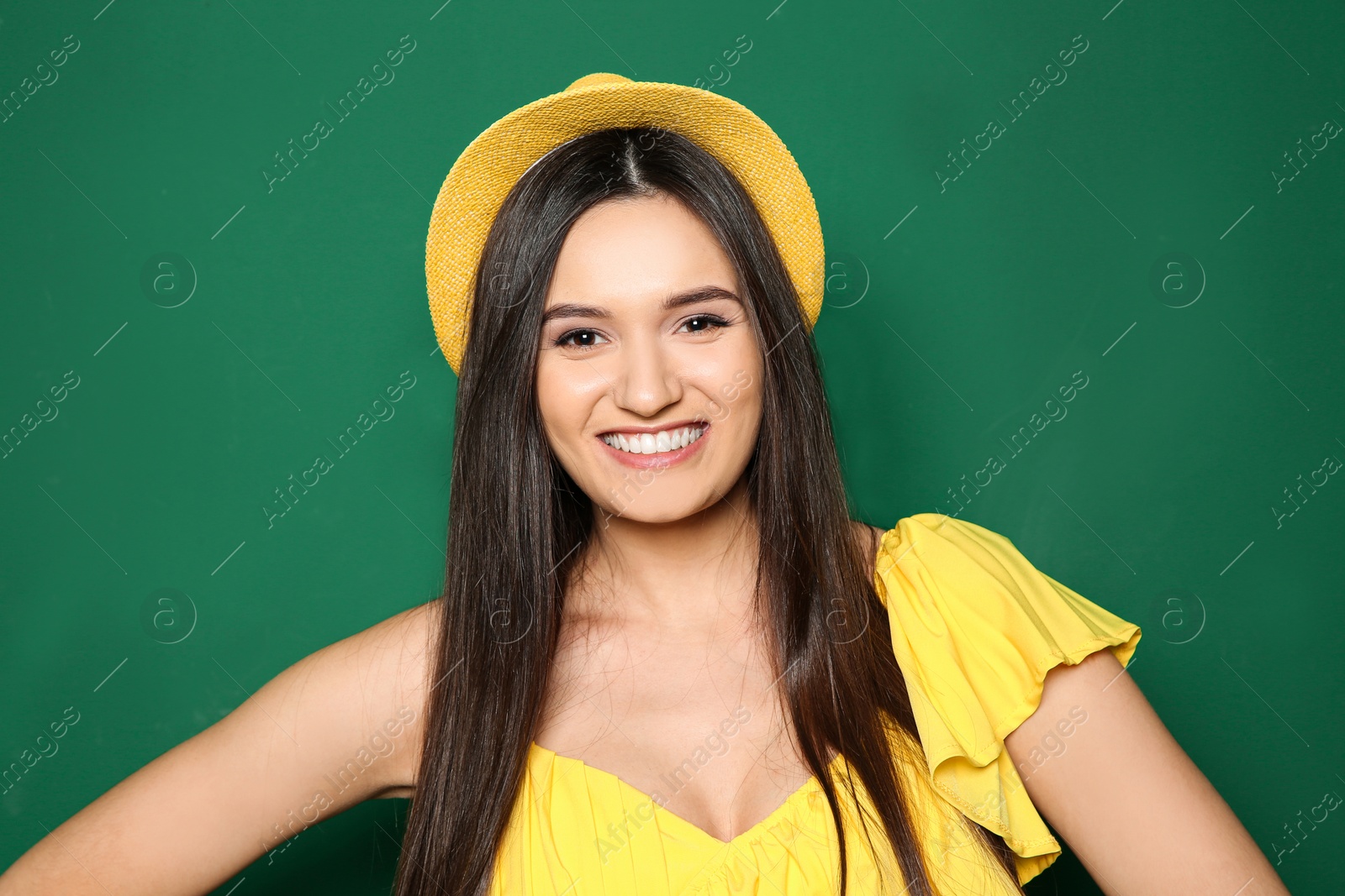 Photo of Portrait of beautiful young woman in stylish clothes on color background