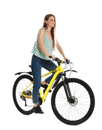 Photo of Happy young woman riding bicycle on white background