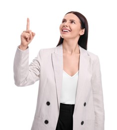 Photo of Beautiful businesswoman in suit pointing at something on white background