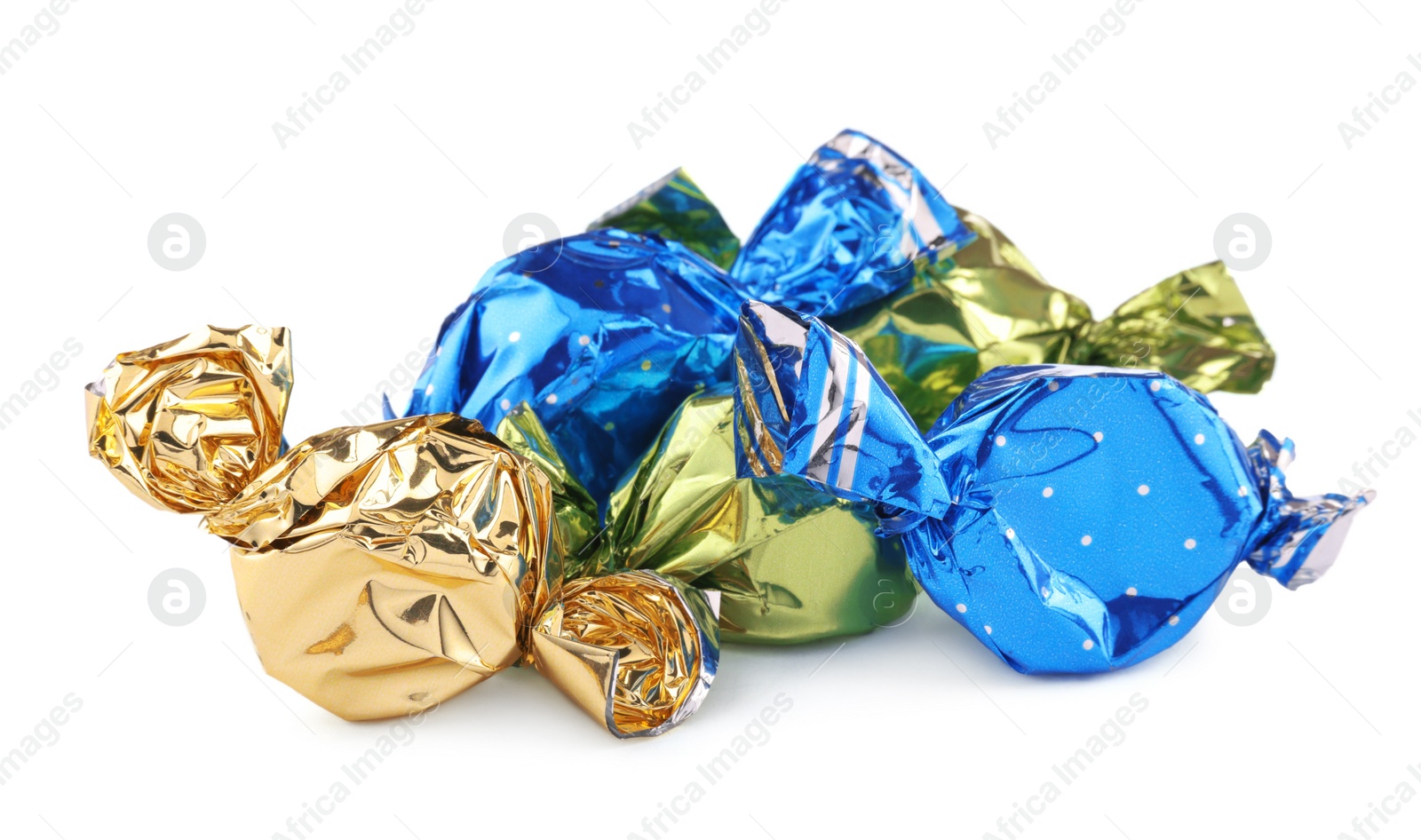 Photo of Candies in colorful wrappers isolated on white