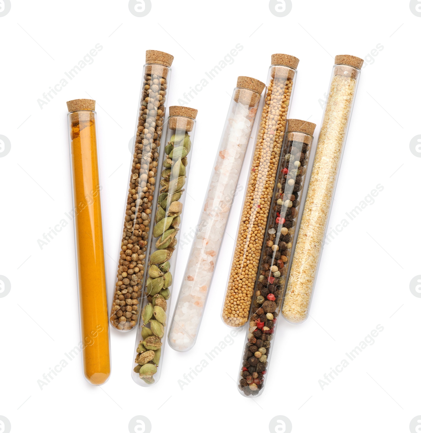 Photo of Glass tubes with different spices on white background, top view