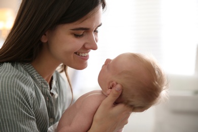 Mother with her newborn baby at home