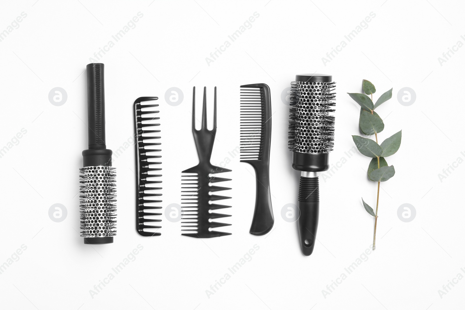 Photo of Composition with hair combs and brushes on white background, top view