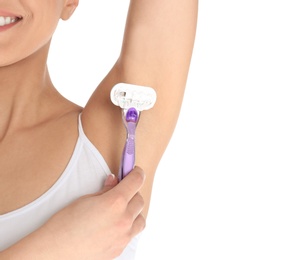 Photo of Beautiful young woman shaving armpit on white background, closeup