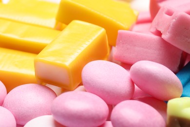 Photo of Different tasty colorful bubble gums as background, closeup