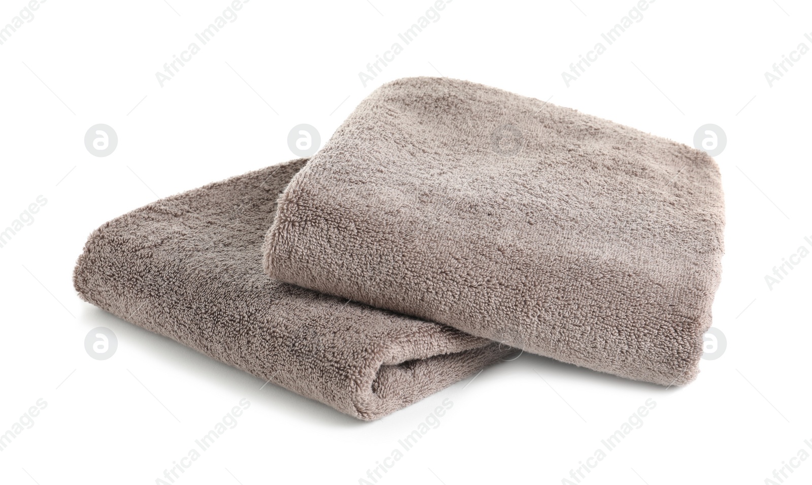 Photo of Fresh soft folded towels isolated on white