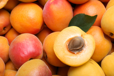 Photo of Delicious fresh ripe apricots as background, closeup