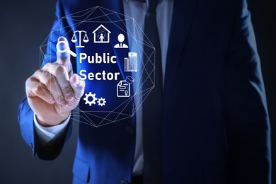 Image of Public Sector concept. Man pointing at virtual screen with different icons on blue background, closeup