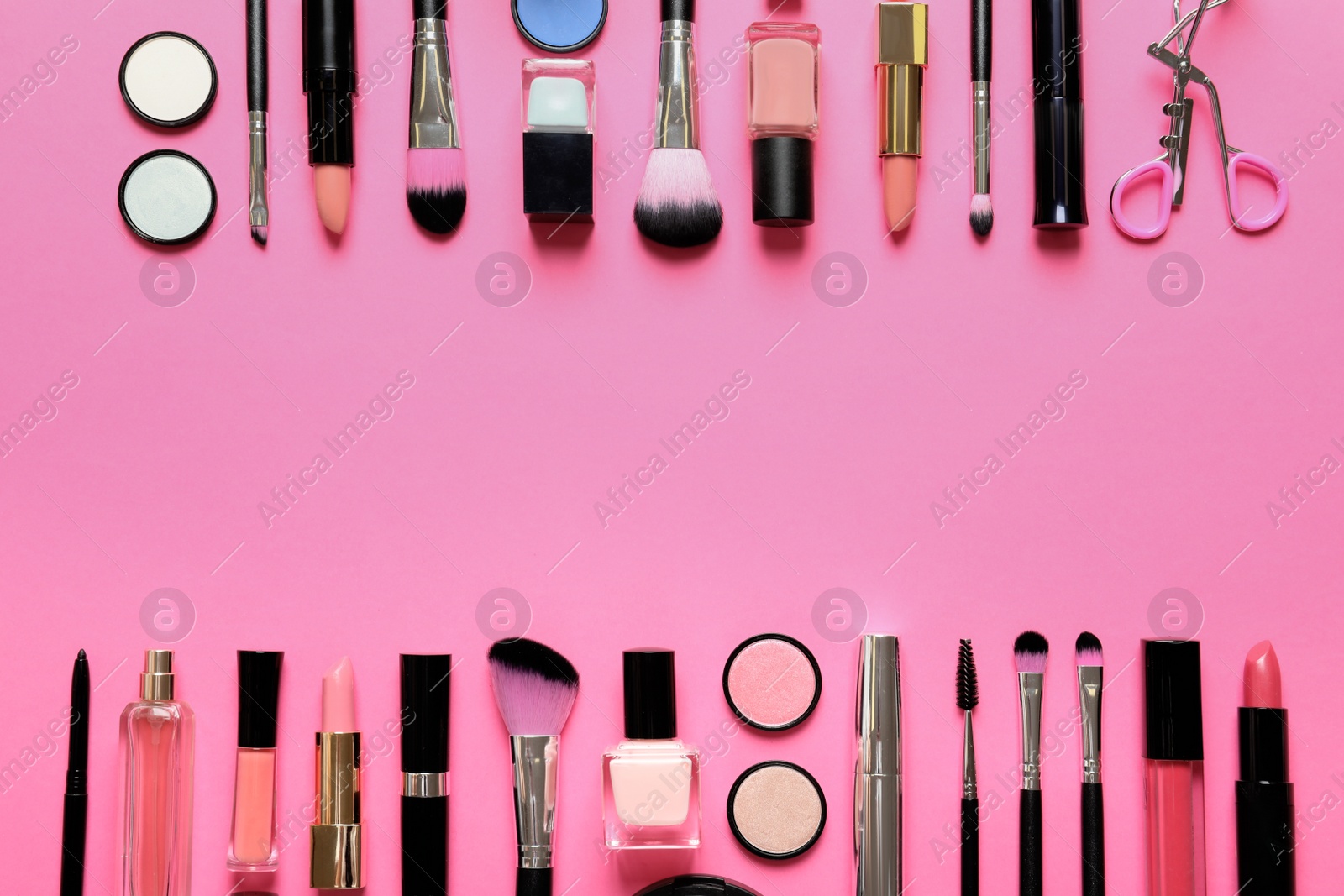 Photo of Flat lay composition with products for decorative makeup on pink background