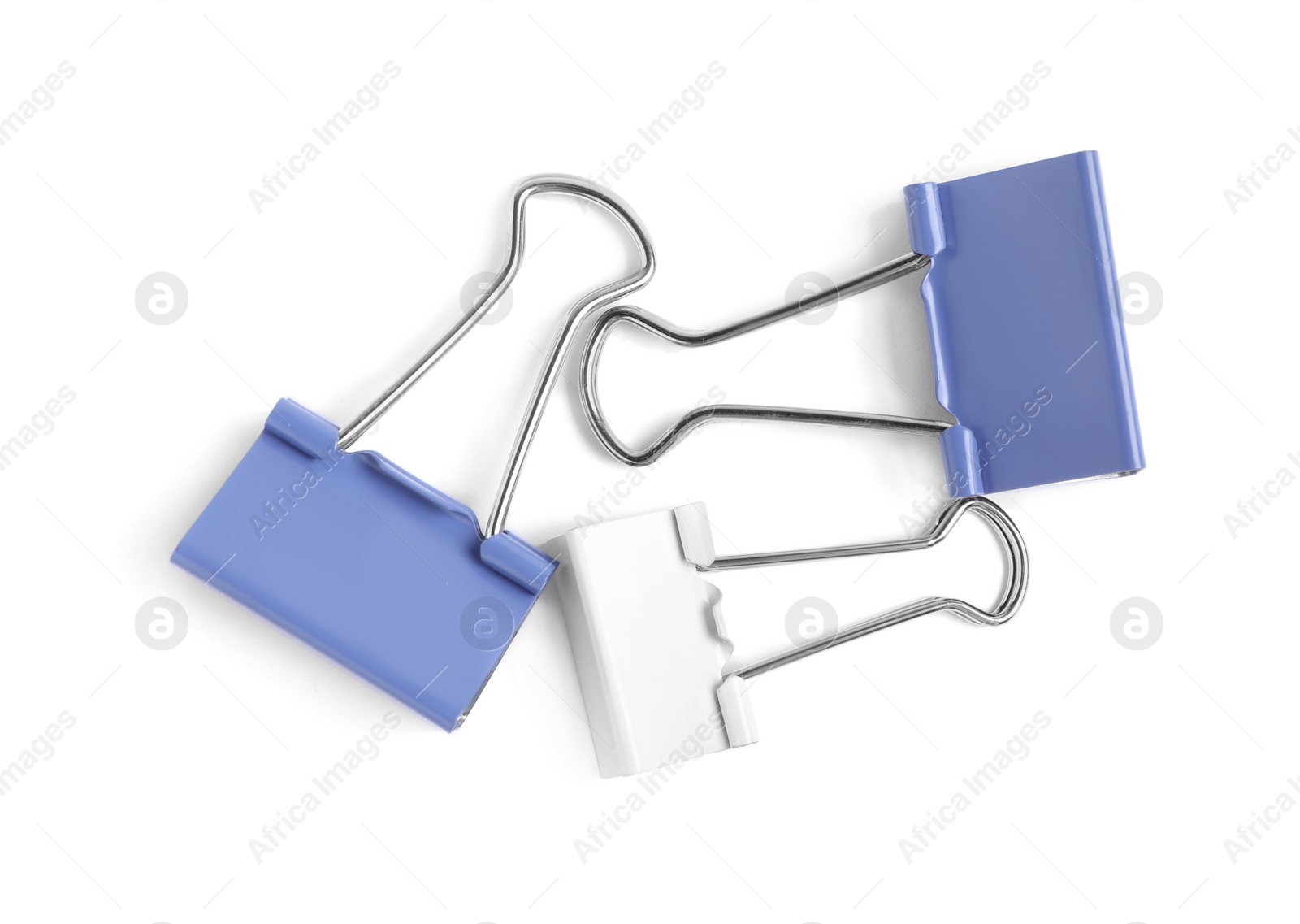 Photo of Colorful binder clips on white background, top view. Stationery item