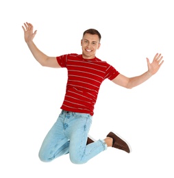 Photo of Happy young man jumping on white background