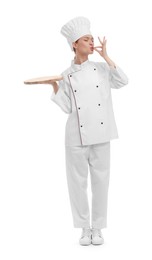 Photo of Young chef in uniform holding empty wooden board and showing perfect sign on white background